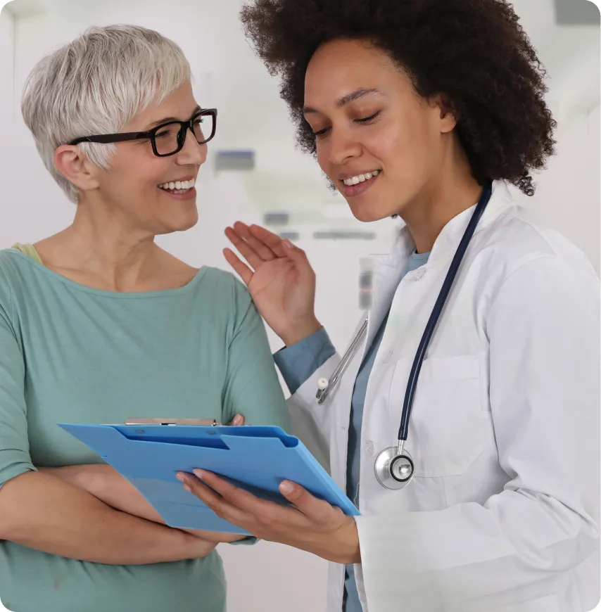A doctor and a resident discussing care