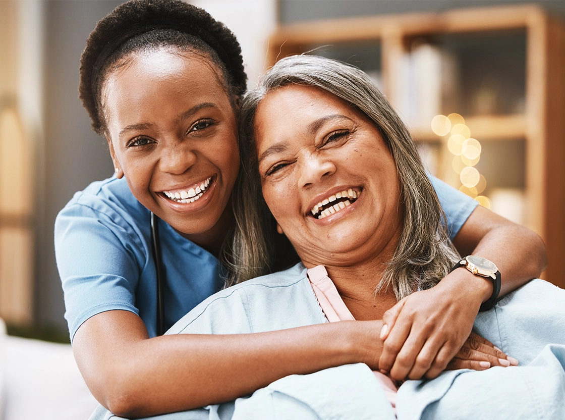 Happy caregivers and residents sharing a moment.