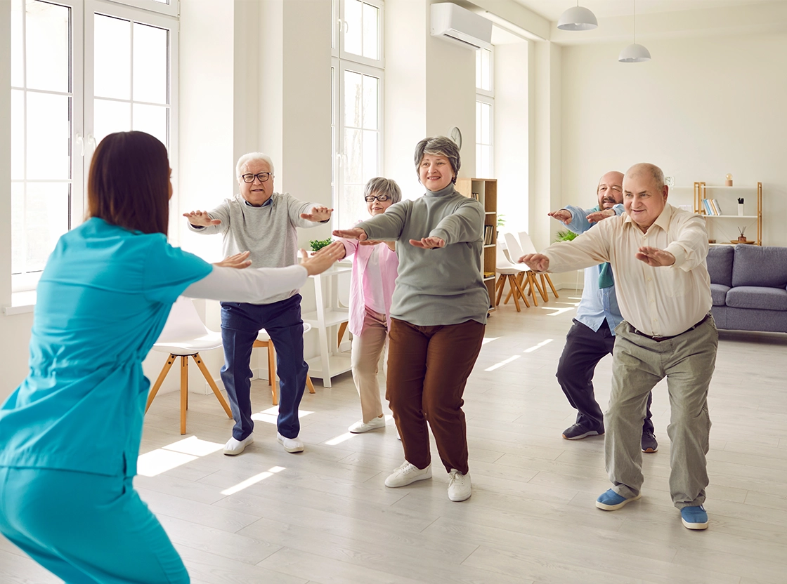 Seniors participating in a group exercise activity
