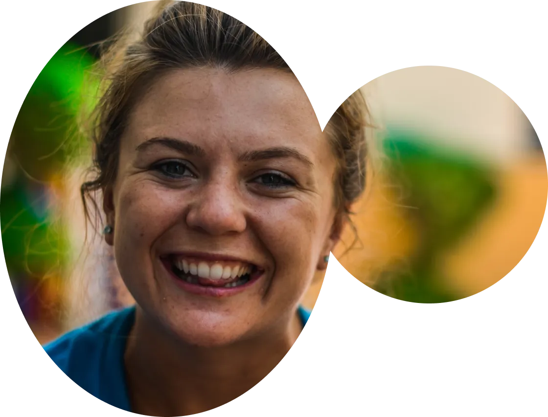 Smiling staff member in a vibrant setting.