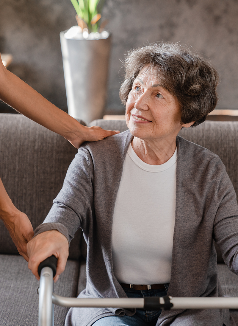 Resident interacting with caregiver indoors