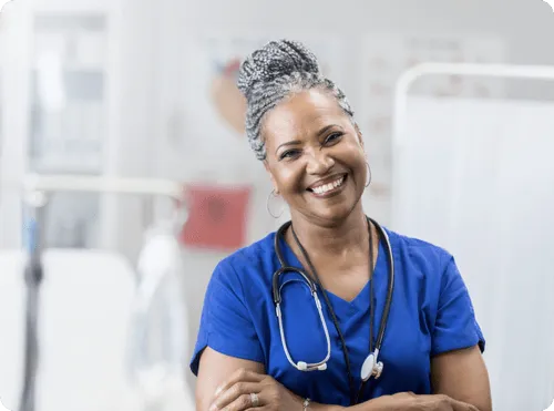 Smiling nurse in scrubs with a stethoscope