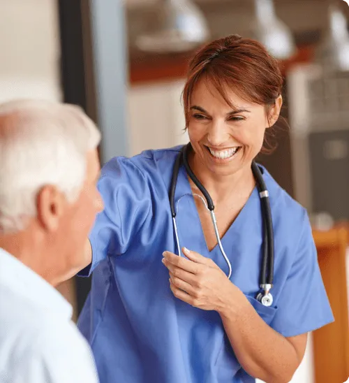 Healthcare worker interacting with a senior resident