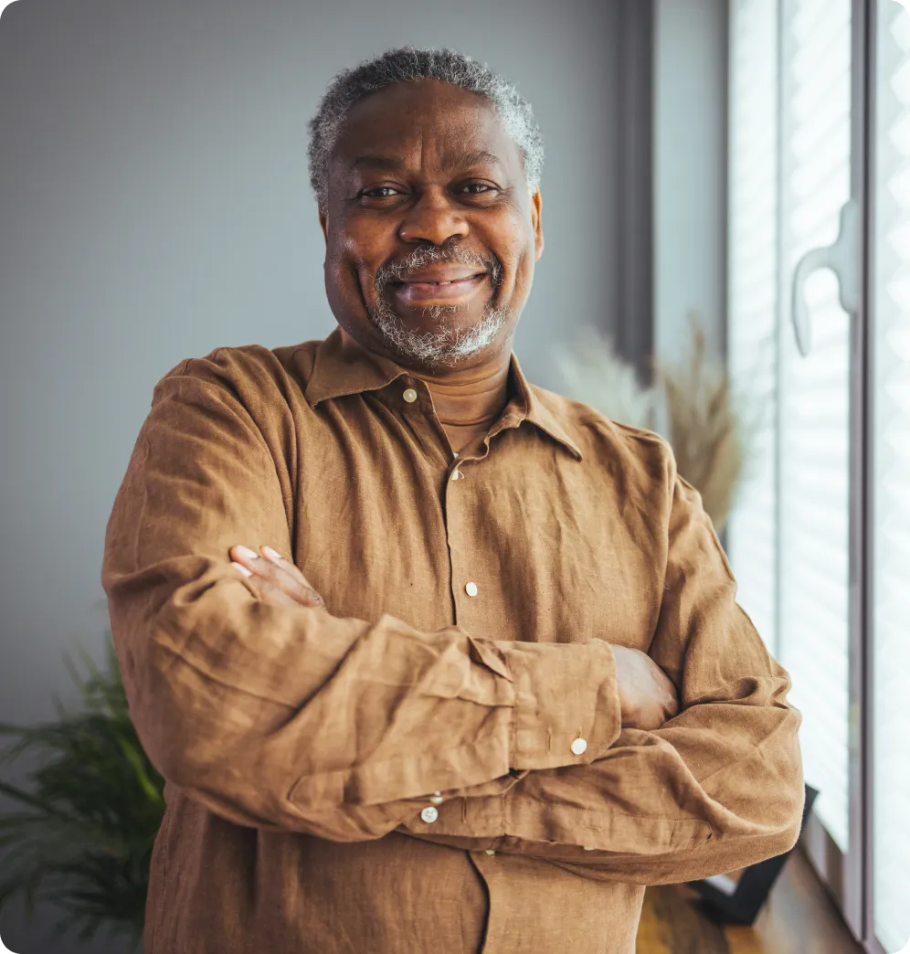 Smiling senior man in a well-lit indoor space