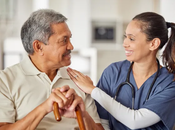 A caregiver interacting with a senior resident.