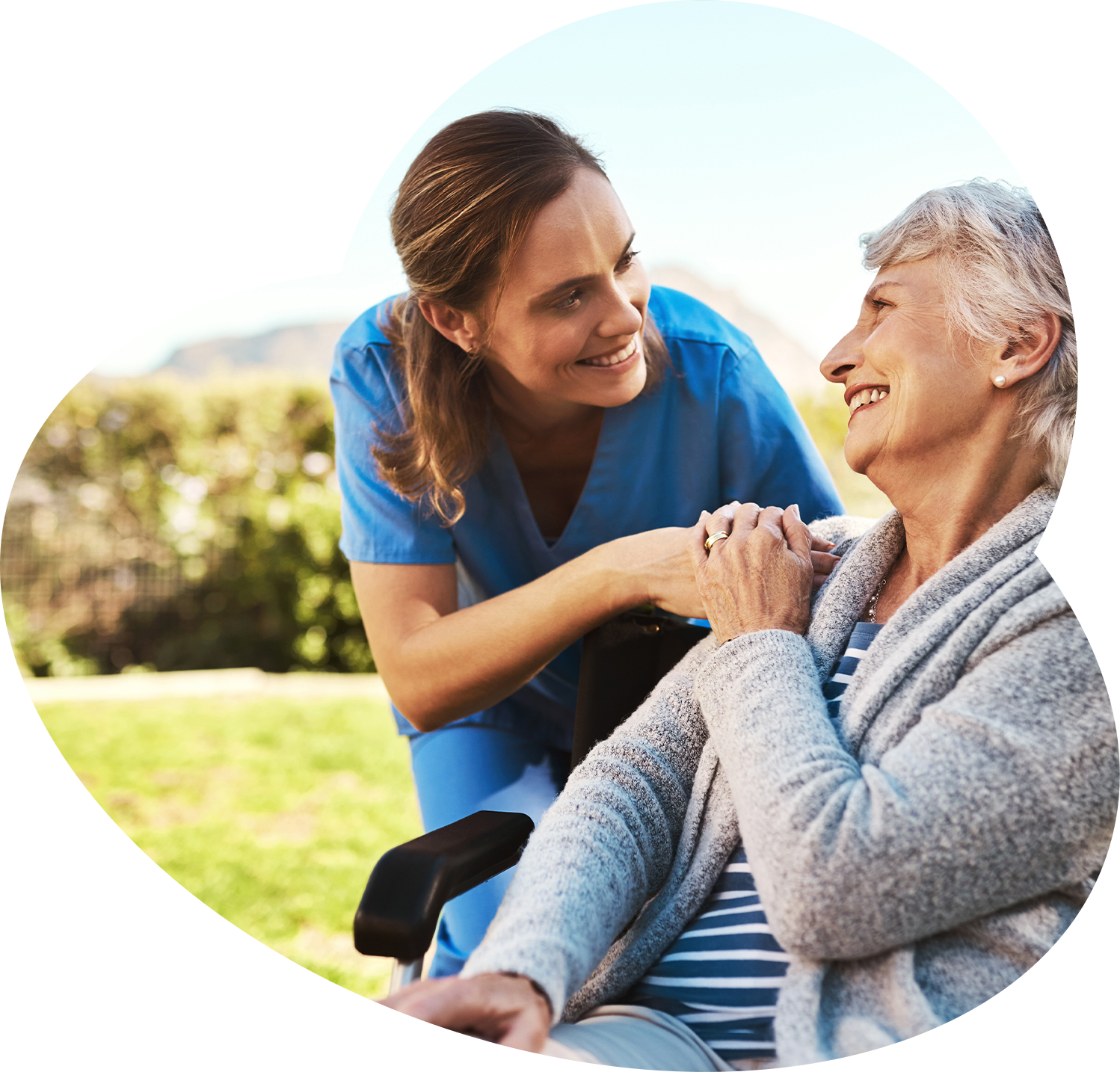 Care staff interacting with a resident outdoors