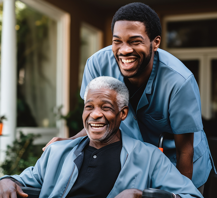 Staff member with a smiling resident outdoors