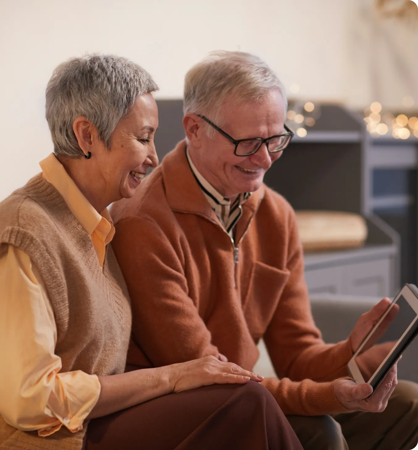 Two seniors enjoying a tablet together.