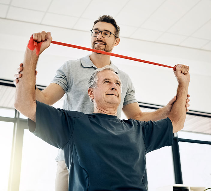 Physical therapy session with a resident and staff member.