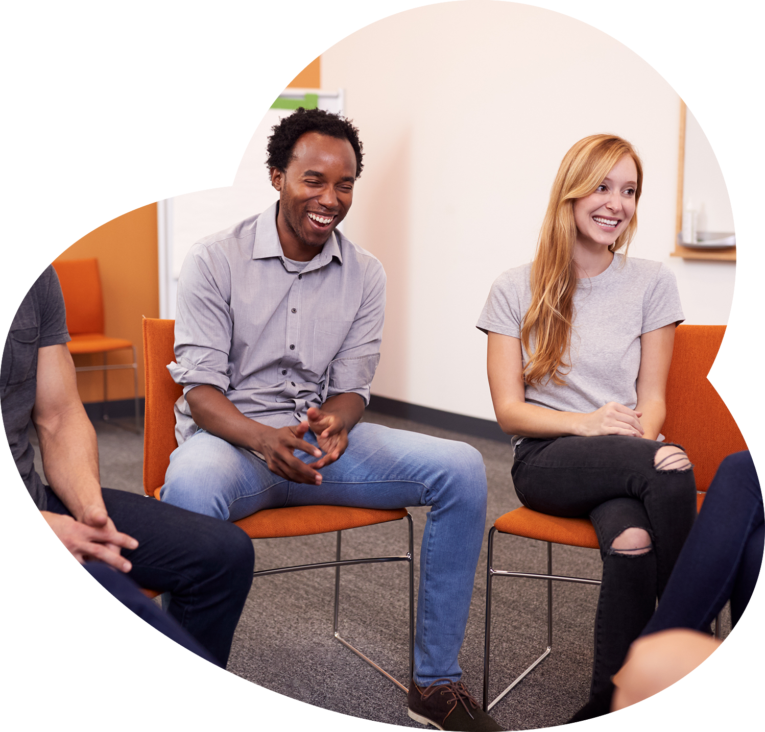 Group of people smiling in a circle