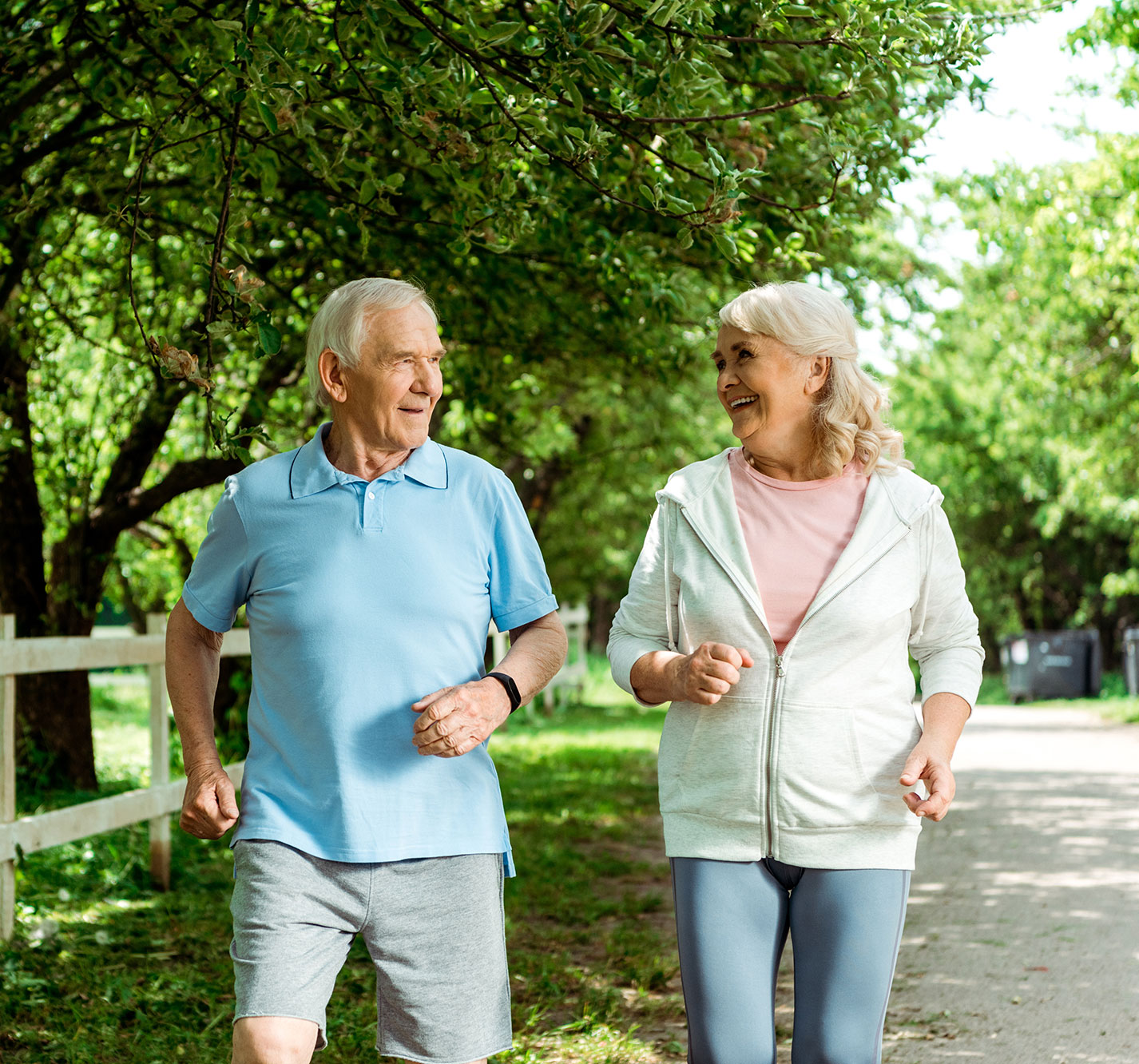 Seniors jogging together in a park
