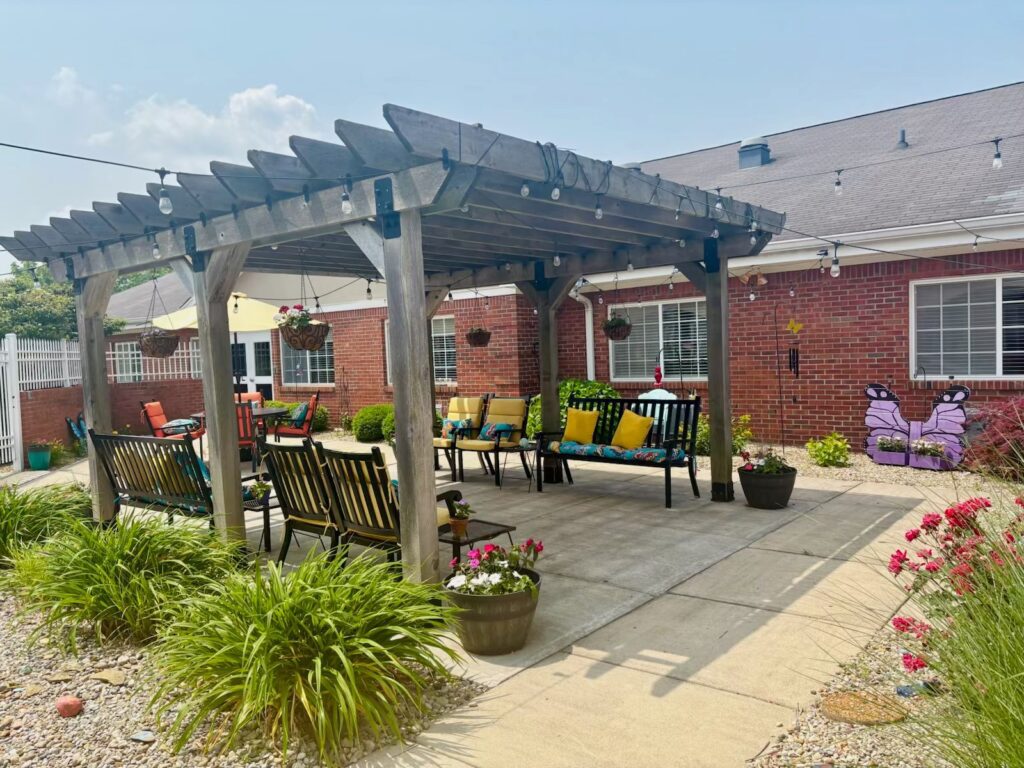 Outdoor seating area with colorful decor and plants
