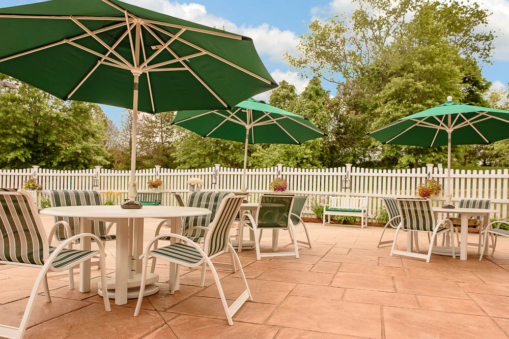 Outdoor seating area with green umbrellas