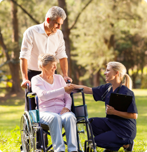 Care staff assisting a resident outdoors