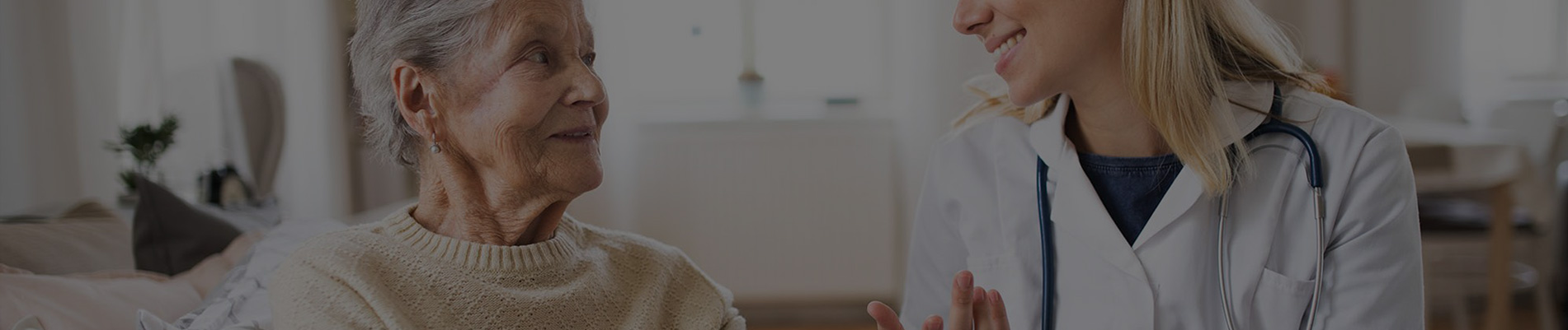Senior resident interacting with healthcare staff