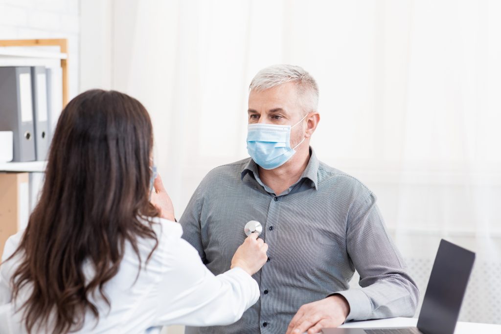 Healthcare professional examining a patient