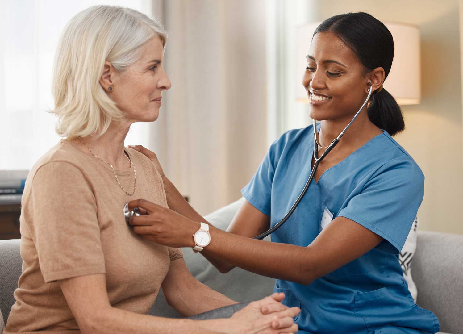 Nurse conducting a health check on a resident.