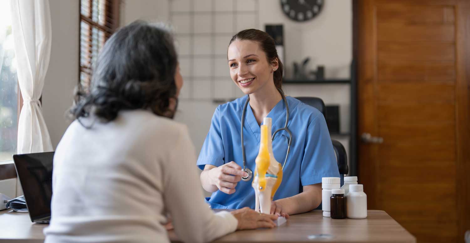 Healthcare professional consulting with an elderly patient