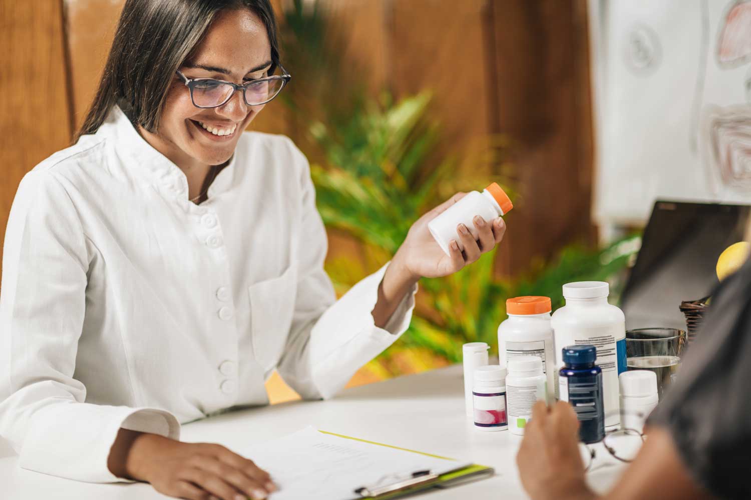 Healthcare professional with medication bottles