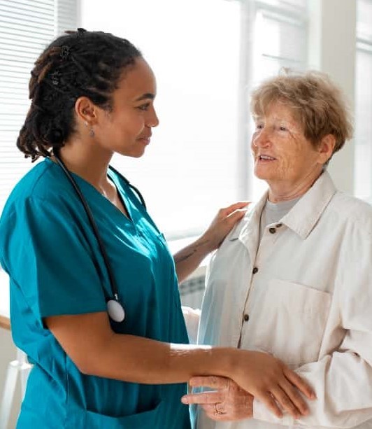 Caregiver with a resident in a warm interaction