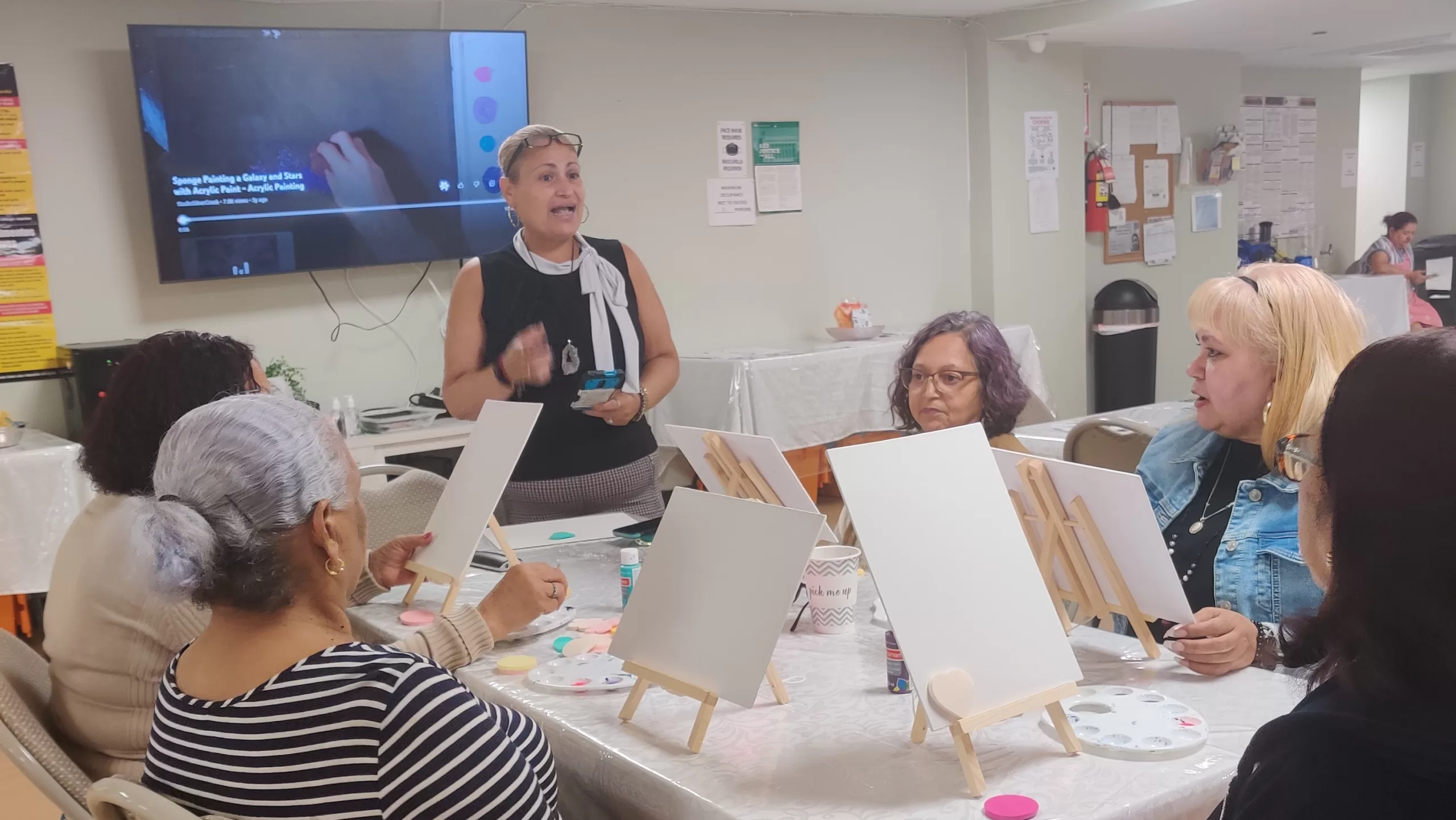 Residents participate in an art activity together.