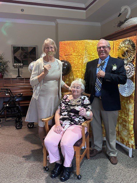 Residents and staff celebrating together indoors