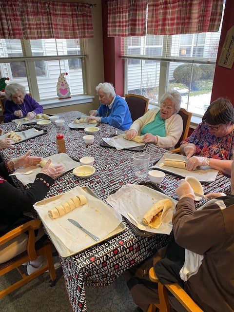 Residents engaged in a baking activity together.