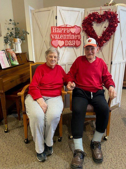 Couple in red sweaters celebrating Valentine's Day