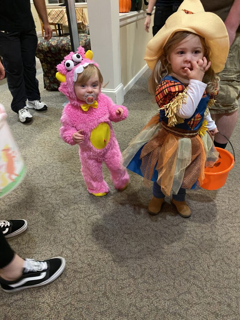 Children in costumes at a facility event.