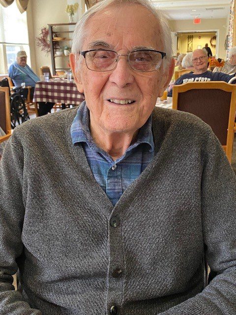 Senior resident smiling in a common area