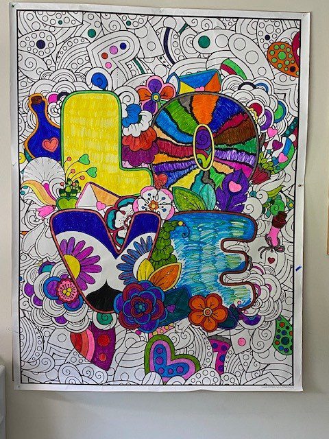 Colorful 'LOVE' artwork on a wall