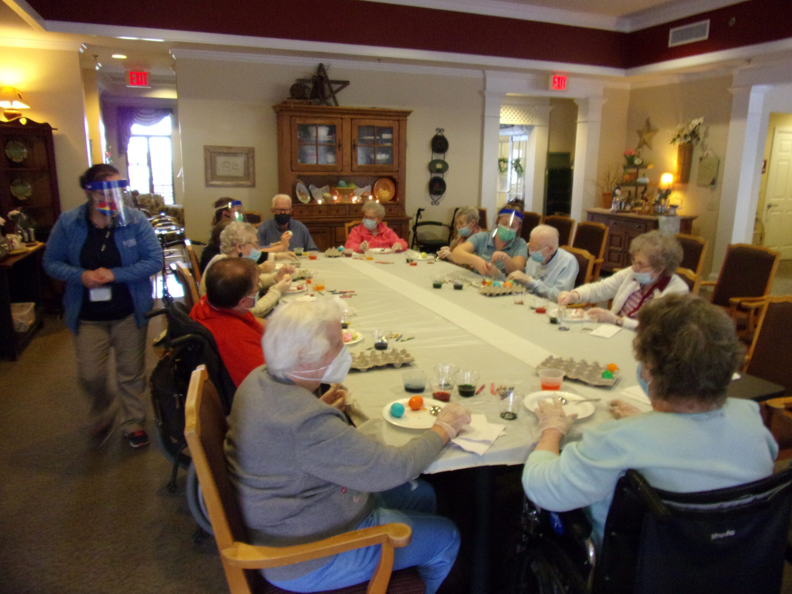 Residents engaged in a group crafting activity.