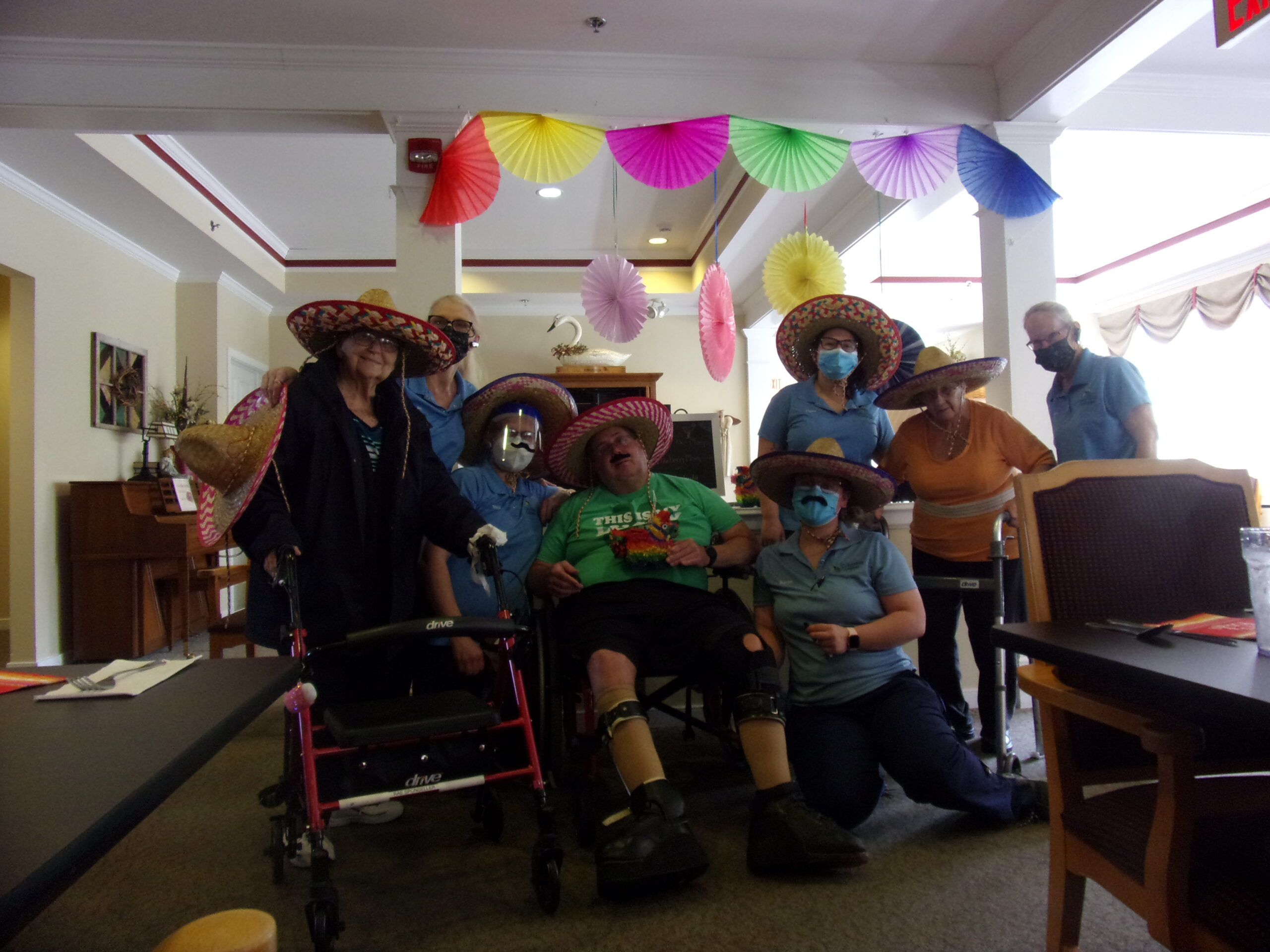 Residents and staff celebrating in festive attire