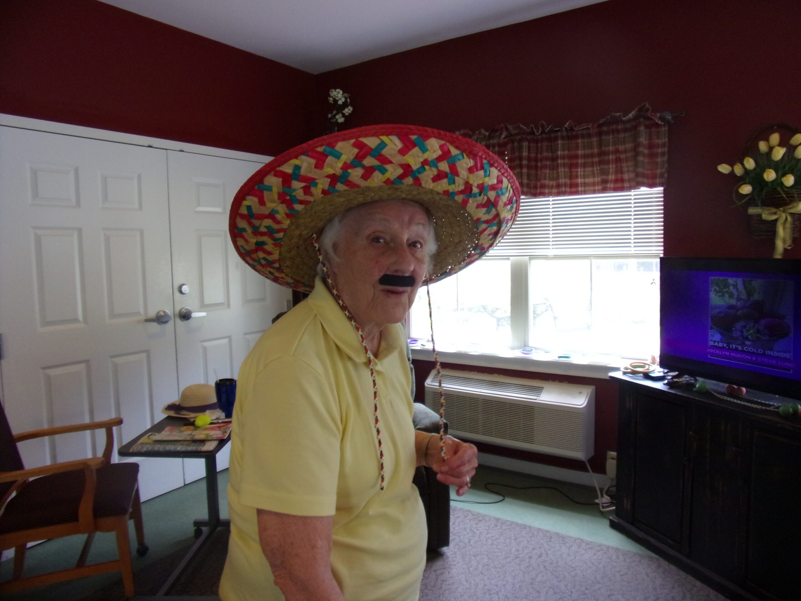 Resident wearing a sombrero and mustache costume.