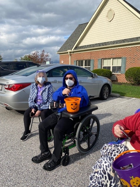 Residents participating in an outdoor Halloween event.