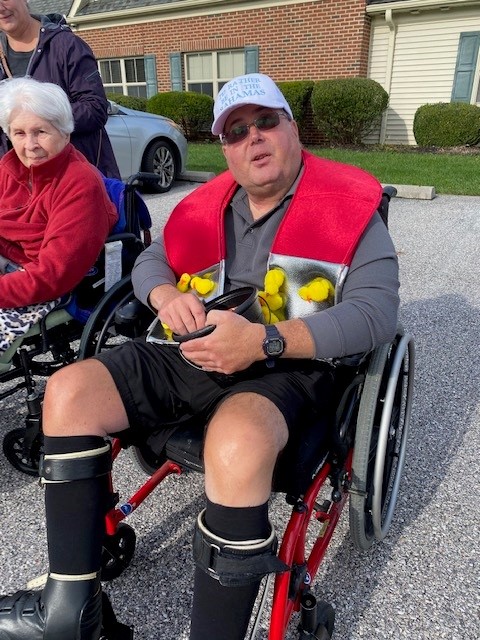Residents enjoying outdoor activities with colorful decorations.