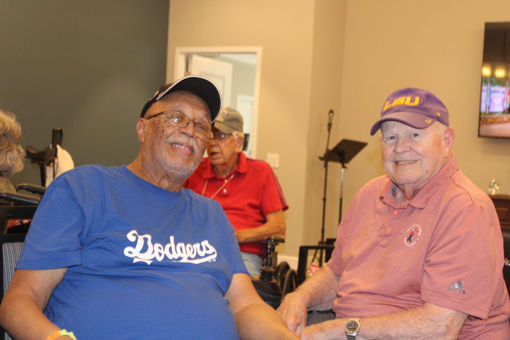 Two residents engaging in a friendly conversation