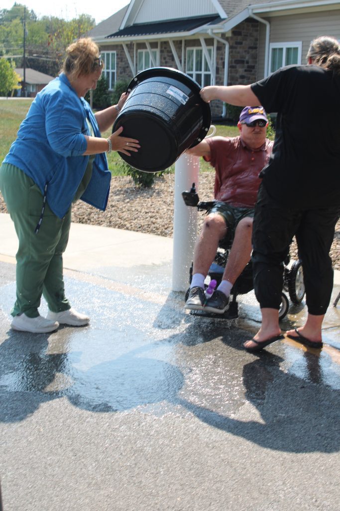 Residents enjoying a water activity outdoors.