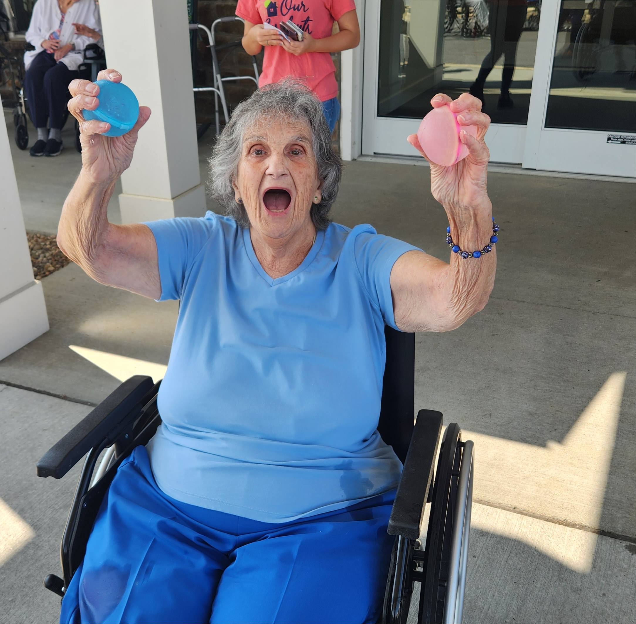 Older adult enjoying an activity with colorful objects.