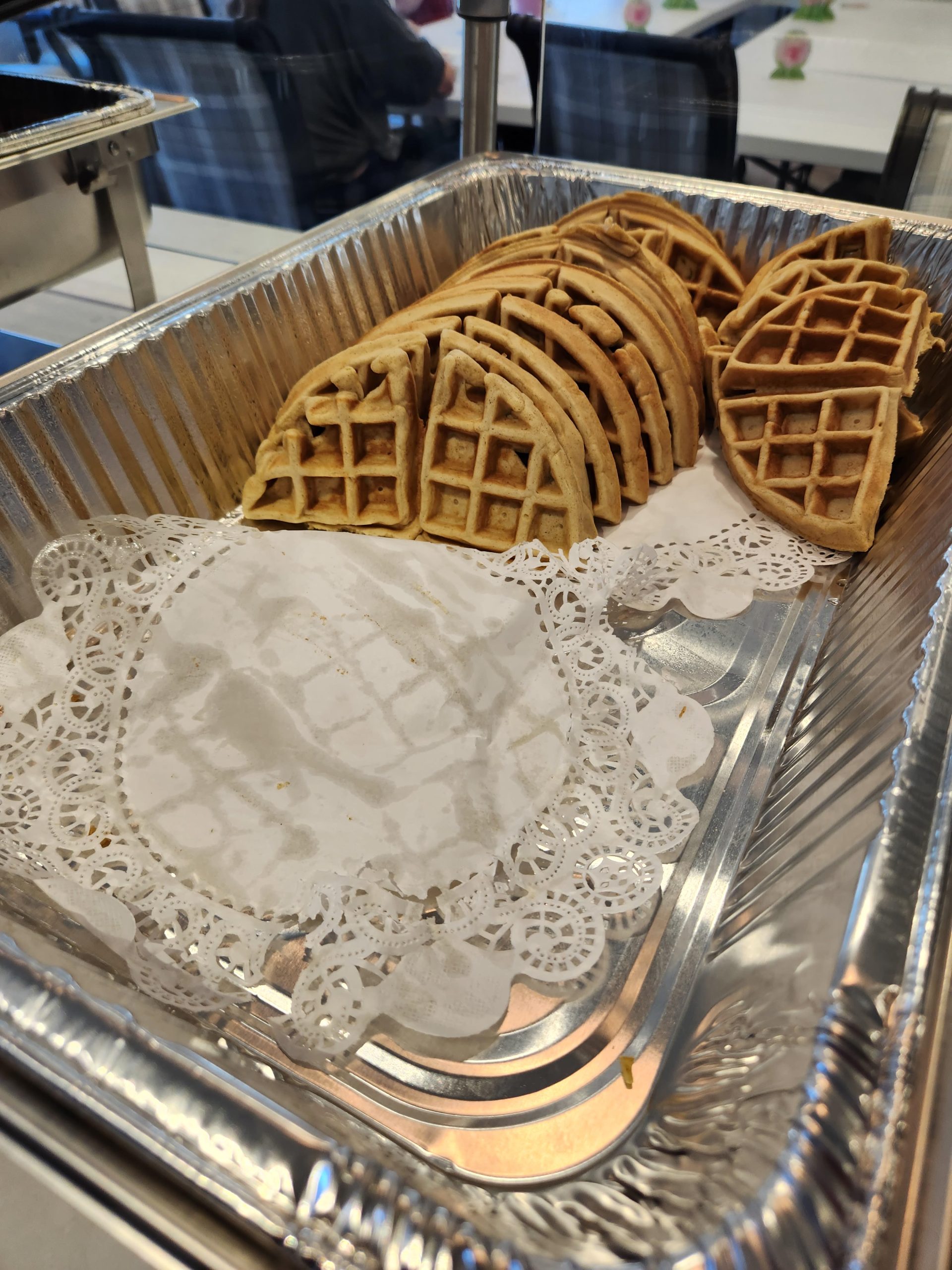 A tray of waffles in a dining area.