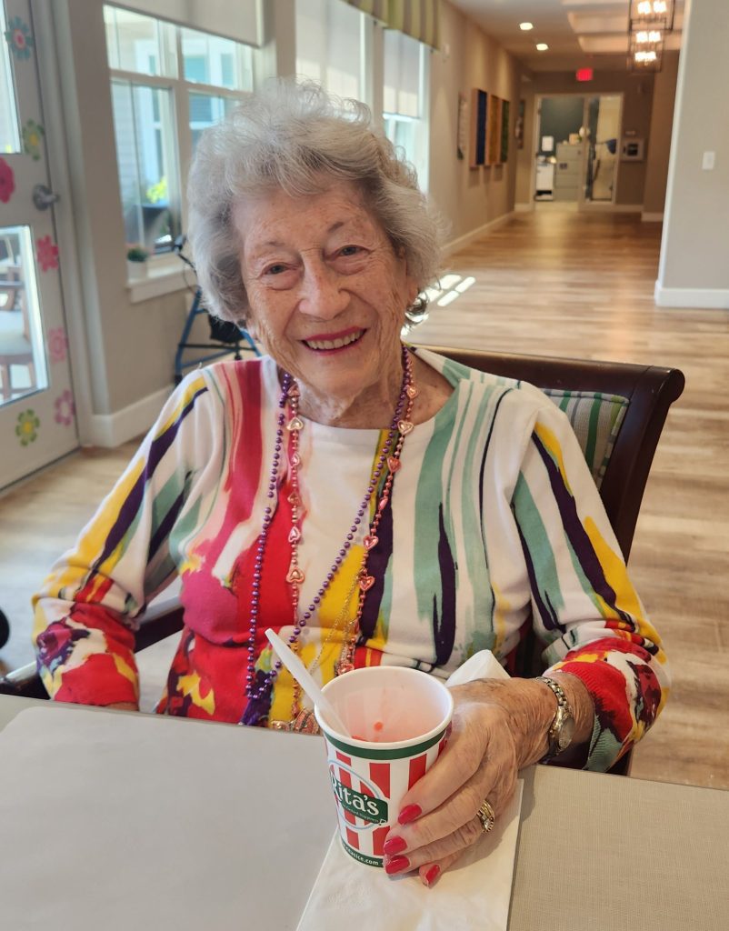Resident enjoying a treat in the common area.