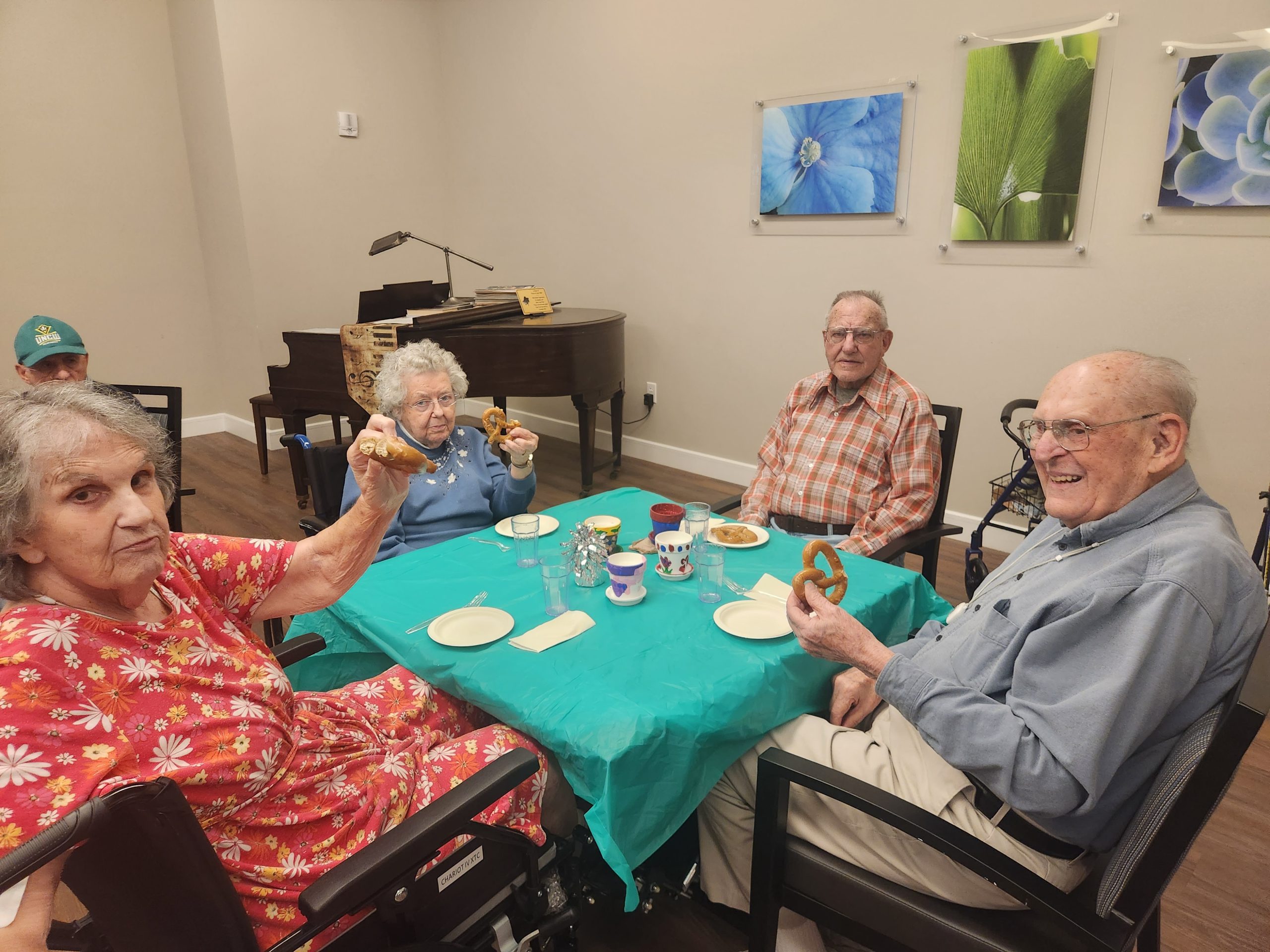 Residents enjoying snacks and activities indoors