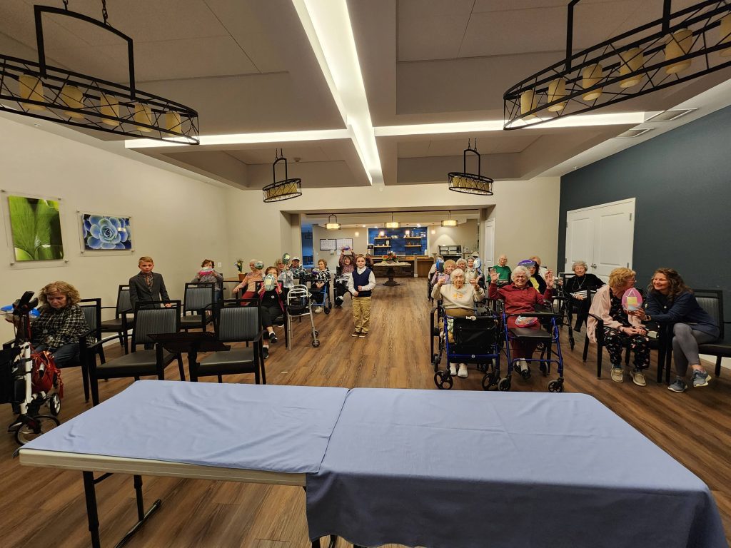 Residents and staff in a common area.