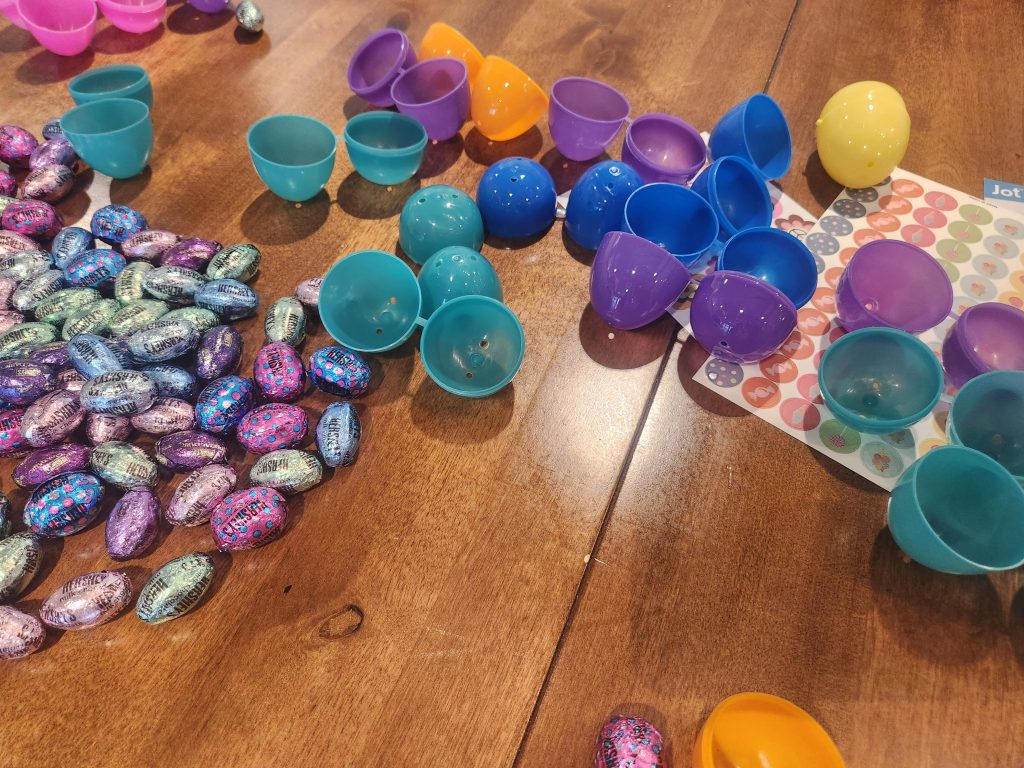 Colorful plastic eggs scattered on a table