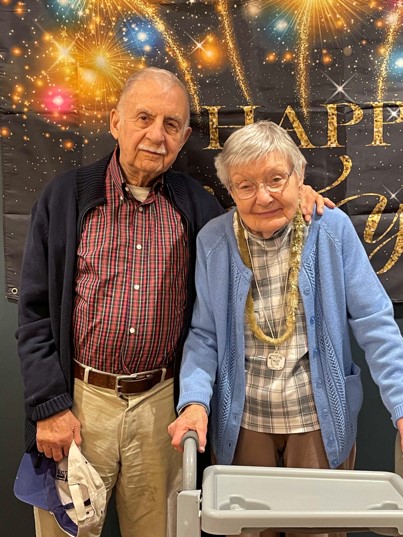 Two residents celebrating with smiles