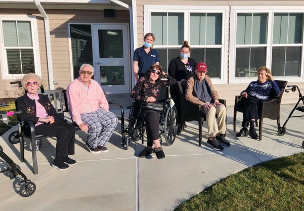Residents enjoying time outdoors in a social setting.