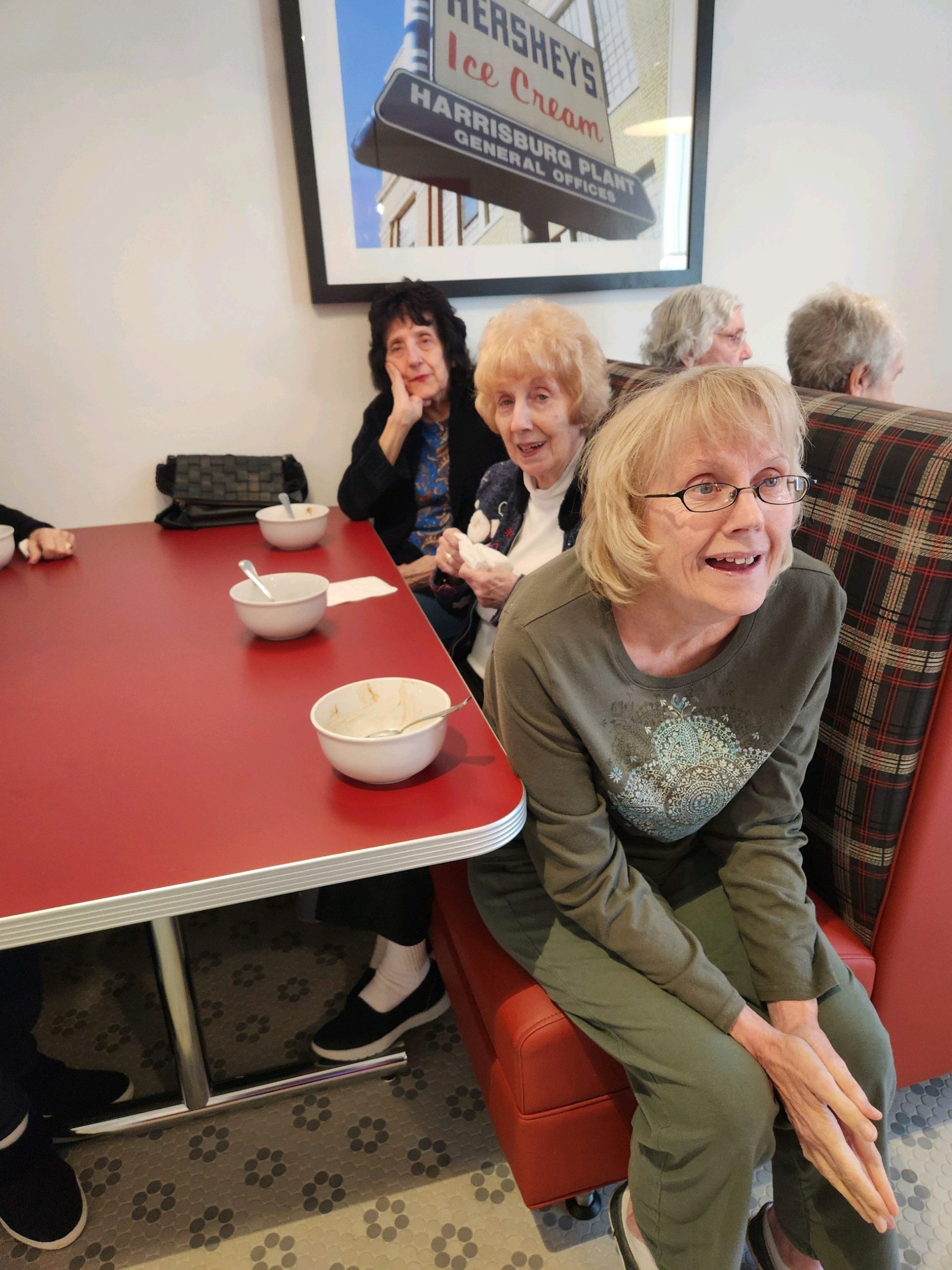 Residents enjoying ice cream at a common area.