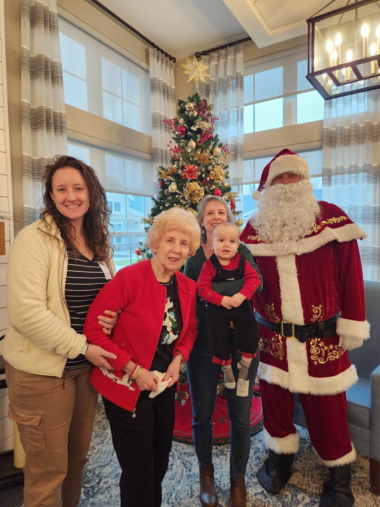 Residents and family members celebrating with Santa.