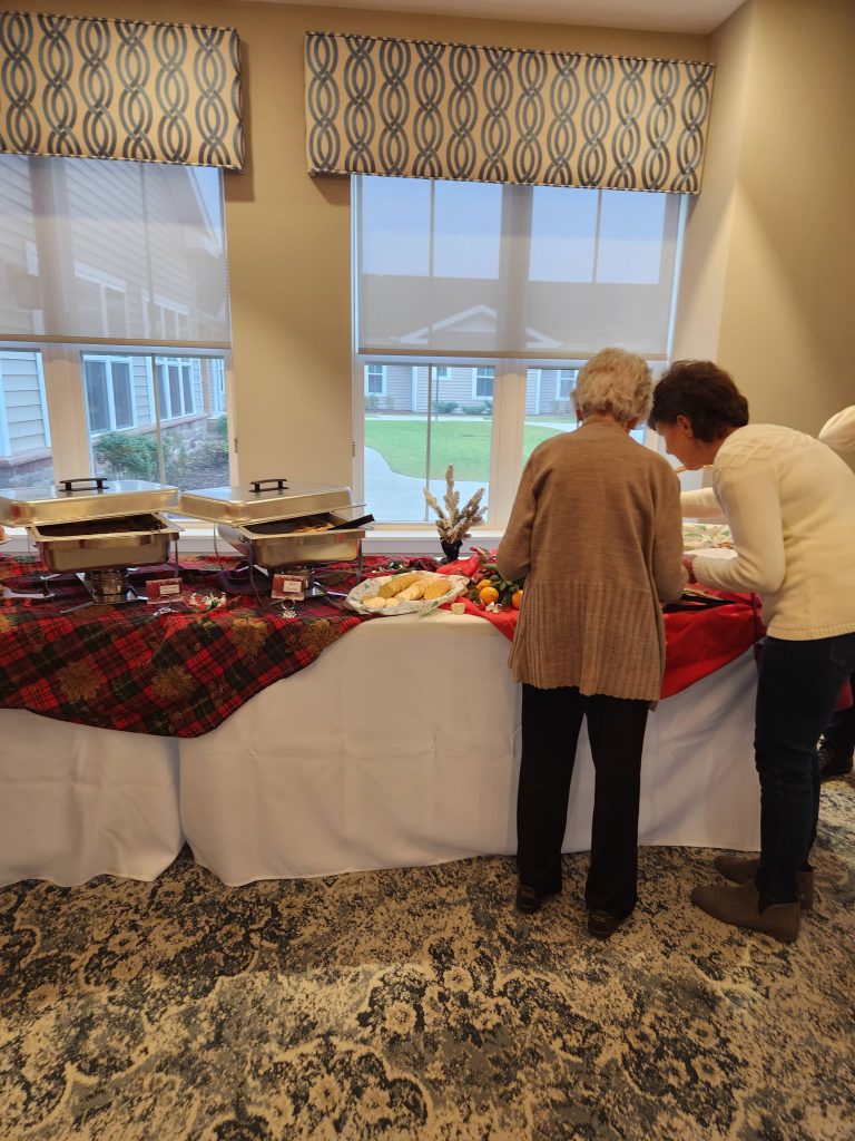 Residents enjoying a meal at a buffet