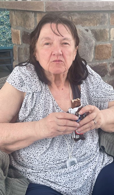 Senior woman enjoying ice cream outdoors